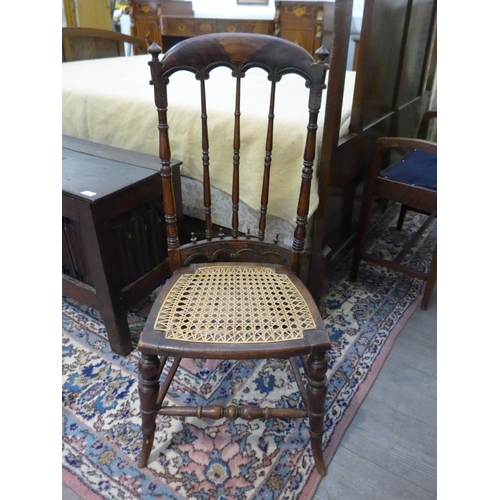 7515 - A Victorian Gothic child's chair with high back,  cane seat