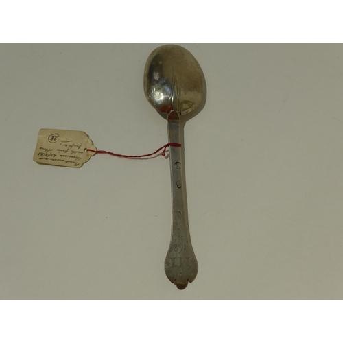 7018 - A James II silver trefoil spoon, London 1685, the terminal with punched initial and date, 19cm long,... 