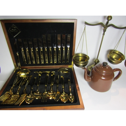 4372 - A Japanese canteen of gold plated, an enamel teapot and weighing scales