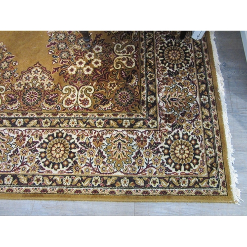 7632 - A mustard ground machine woven rug, central floral medallion, 266cm x 350cm