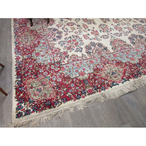 7633 - A large 20th Century cream carpet with central floral medallion and further floral sprays, 322cm x 5... 