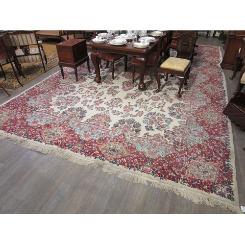 7633 - A large 20th Century cream carpet with central floral medallion and further floral sprays, 322cm x 5... 