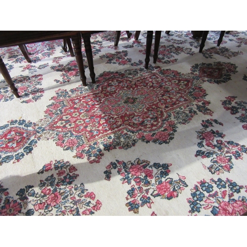 7633 - A large 20th Century cream carpet with central floral medallion and further floral sprays, 322cm x 5... 