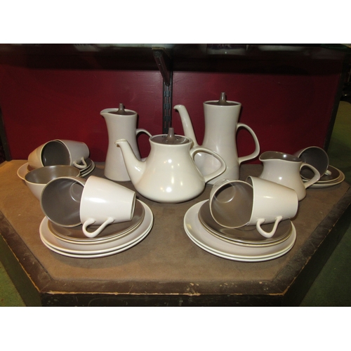 4006 - A quantity of Poole Pottery tea and coffee ware, two-tone mushroom and sepia colour way