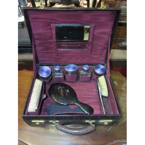 4017 - An Asprey vintage leather vanity travelling case, monogrammed J.B puce moire silk interiors containi... 