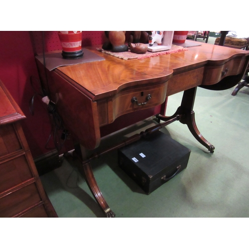 4073 - A George III revival crossbanded flame mahogany and burr walnut sofa table. The rising leaves over a... 