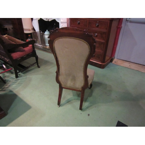 4213 - A William IV rosewood chair with carved decoration over a serpentine front seat on carved fore cabri... 