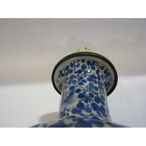 1296 - A Chinese blue and white porcelain vase of baluster form, allover foliage, converted into a lamp bas... 