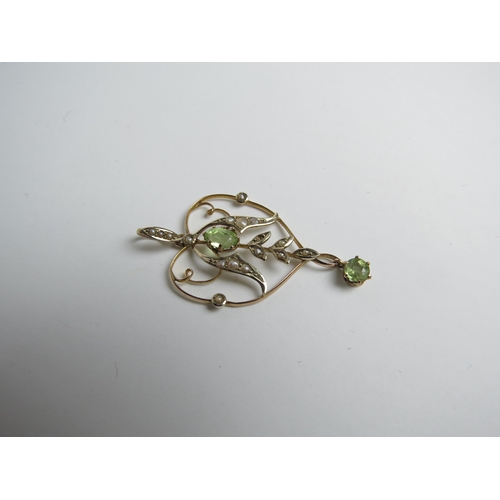 7040 - An Edwardian peridot and seed pearl drop pendant, stamped 9ct, 2.1g