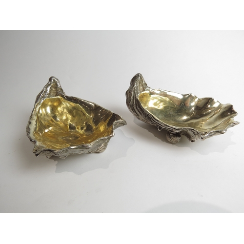 7049 - A pair of silver table salts in the form of clam shells, london 1998, 9cm long, 431g