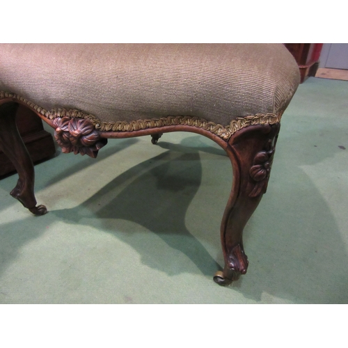 4213 - A William IV rosewood chair with carved decoration over a serpentine front seat on carved fore cabri... 