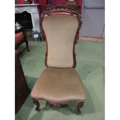 4213 - A William IV rosewood chair with carved decoration over a serpentine front seat on carved fore cabri... 