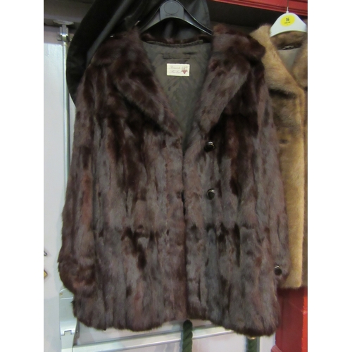 4237 - Two mid-Century fur jackets to include a Norwich Fur Co. Canadian squirrel with elegant circular but... 