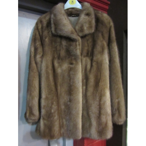 4237 - Two mid-Century fur jackets to include a Norwich Fur Co. Canadian squirrel with elegant circular but... 