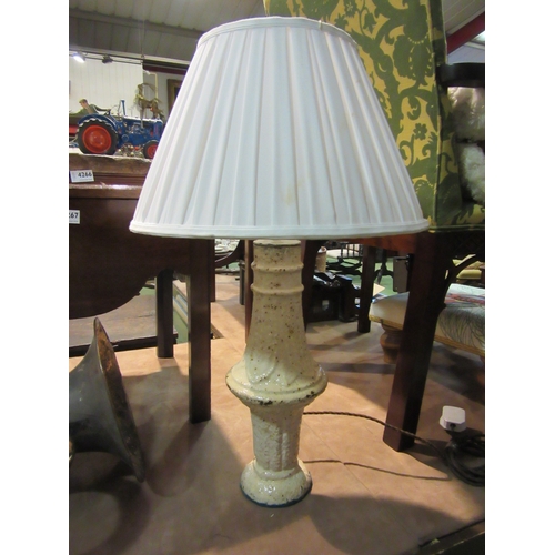 4265 - A cast iron table lamp with pleated shade