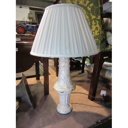 4265 - A cast iron table lamp with pleated shade