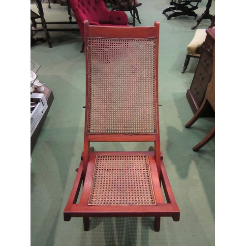 4281 - A 19th Century teak folding steamer chair with cane seat and back rest