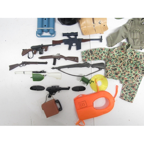 9212 - A collection of vintage Action Man and similar weapons, accessories and clothing