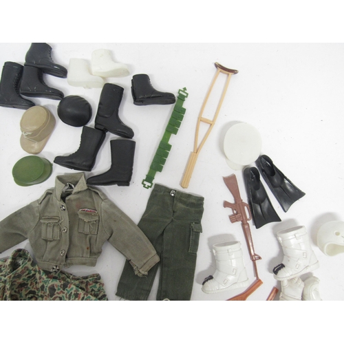 9212 - A collection of vintage Action Man and similar weapons, accessories and clothing