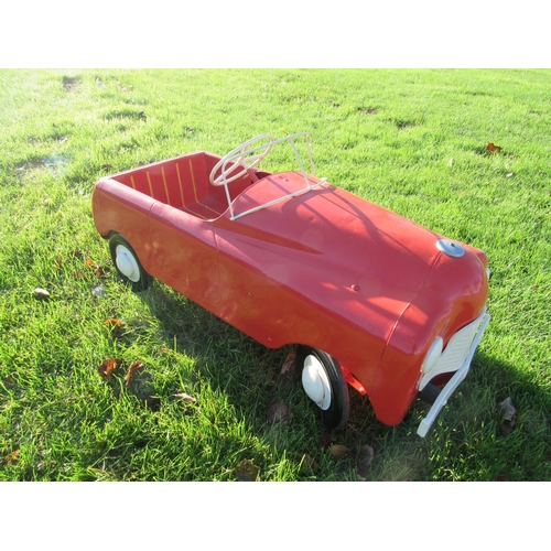 9144 - A mid 20th Century Triang pressed steel pedal car, repainted in red with white grille and hubs, 100c... 