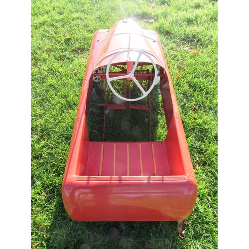 9144 - A mid 20th Century Triang pressed steel pedal car, repainted in red with white grille and hubs, 100c... 