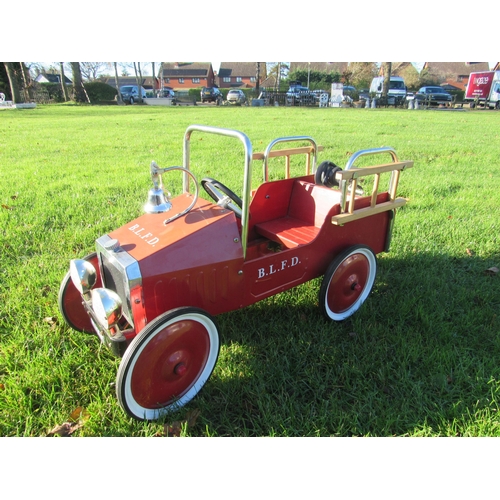 9149 - A pressed steel Buddy L fire engine pedal car with bell to front, hose reel to rear and wooden ladde... 