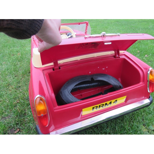 9140 - A 1980s Sharna for Triang Rolls Royce Corniche pedal car with electric motor, red moulded plastic bo... 