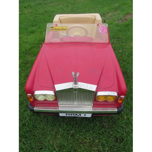 9141 - A 1980s Sharna for Triang Rolls Royce Corniche pedal car with electric motor, red moulded plastic bo... 