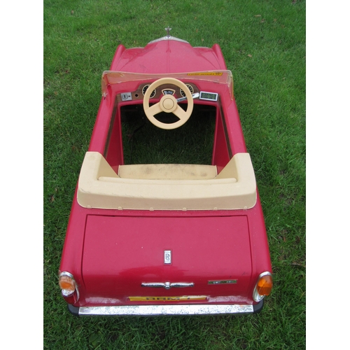 9141 - A 1980s Sharna for Triang Rolls Royce Corniche pedal car with electric motor, red moulded plastic bo... 