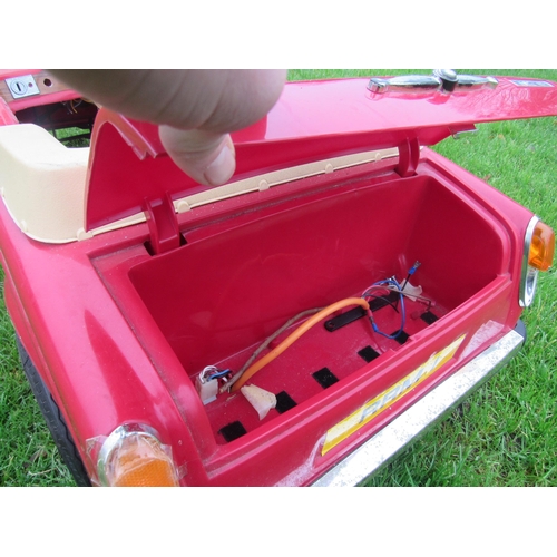 9141 - A 1980s Sharna for Triang Rolls Royce Corniche pedal car with electric motor, red moulded plastic bo... 