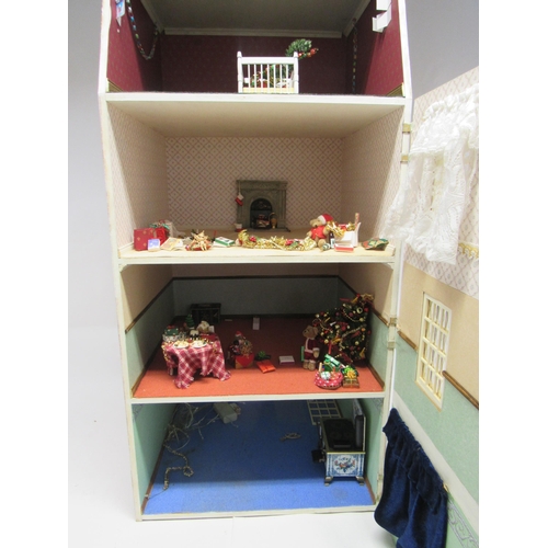 9222 - A wooden front opening dolls house in the form of a three storey townhouse with attic above, contain... 