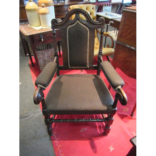 1185 - A 17th Century oak elbow chair with upholstered seat and back