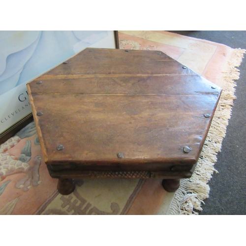 1085 - An Indian hardwood hexagonal top low table, 18cm tall x 71cm long