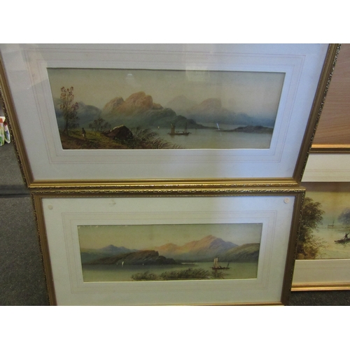 1360 - E.EARLS: Two gilt framed watercolours of boats with mountains to background, both signed bottom righ... 