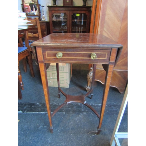 1004 - A 19th Century satinwood inlaid drop-leaf table, single frieze drawer, on square tapering legs to sp... 