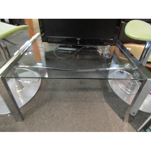 1089 - A chrome and glass coffee table, 39cm tall x 81cm wide