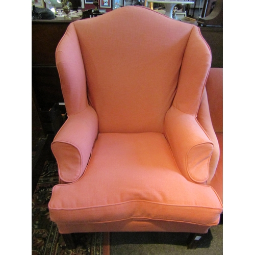 1169 - WITHDRAWN: A pair of Georgian style wingback armchairs, burnt orange upholstery