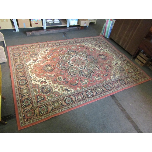 1660 - A peach ground floral design rug with multiple borders, 325cm x 236cm