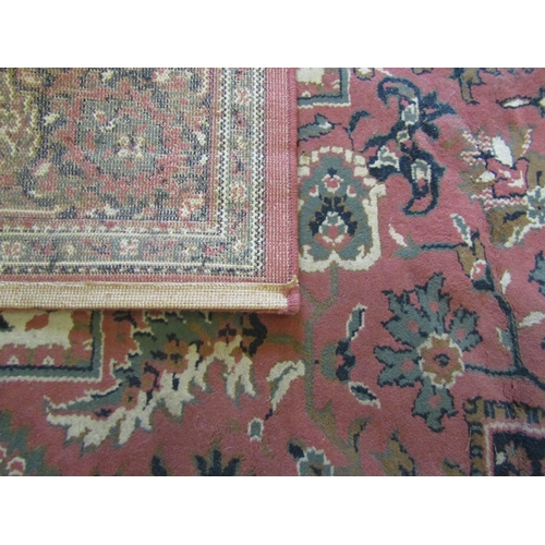 1660 - A peach ground floral design rug with multiple borders, 325cm x 236cm