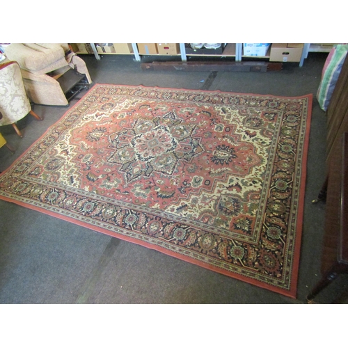 1660 - A peach ground floral design rug with multiple borders, 325cm x 236cm