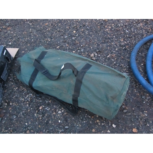 3391 - A bag containing fishing stools and camo netting