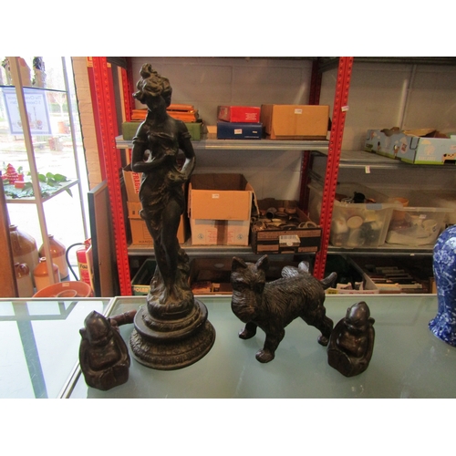 1226 - A spelter figure of semi-clad lady, a Scottie dog, a pair of Buddhas, a walking cane tip in the form... 