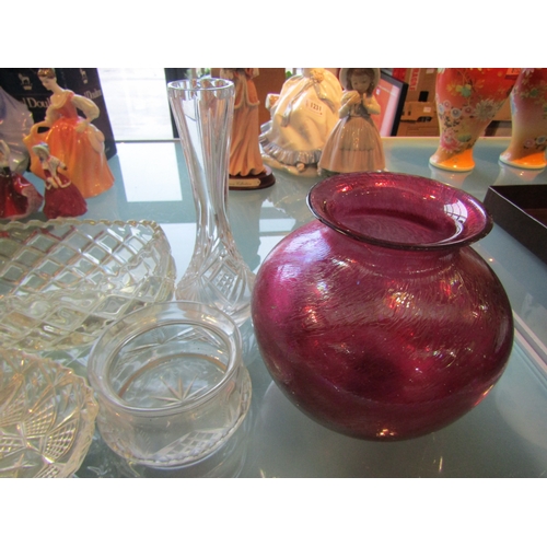 1232 - Seven pieces of glassware including cut glass bowl, two vases and an iridescent vase, chips to rim