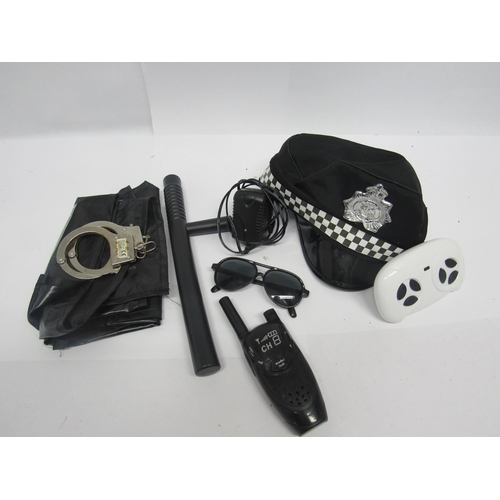 9143 - A Homecom 12v battery driven police car with accessories, 100cm long