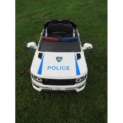 9143 - A Homecom 12v battery driven police car with accessories, 100cm long