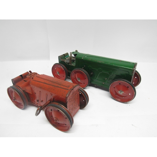 9181 - Two playworn 1930's Triang clockwork tractors, comprising No.2 in red with fixed key mechanism, 21cm... 