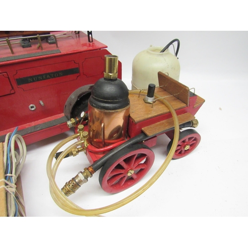 9152 - A scratch built wooden model Nuneaton fire service fire engine, 64cm long, with live steam trailer c... 