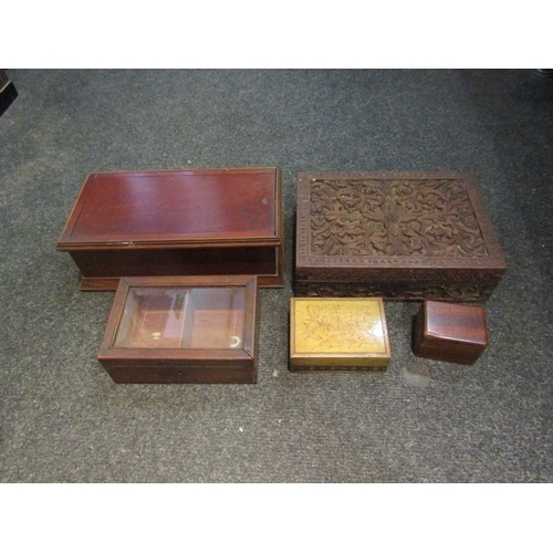 1560 - A box of treen to include mahogany box with sliding lid, heavily carved box, mahogany cigar box with... 