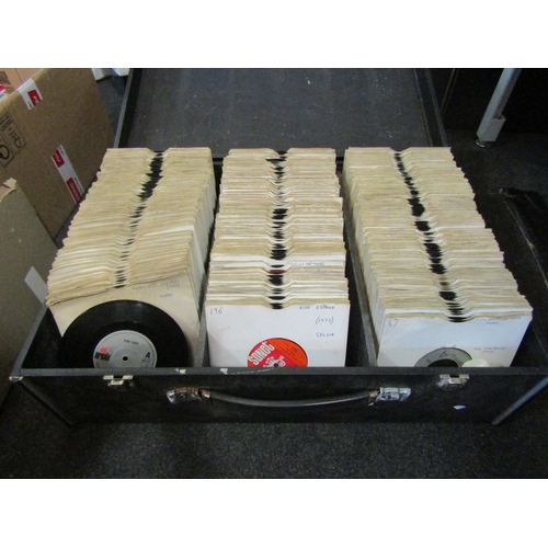 1645 - Three flight cases containing a quantity of 1970's and 80's vinyl record singles including Nik Kersh... 