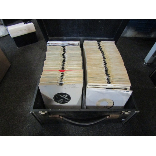 1645 - Three flight cases containing a quantity of 1970's and 80's vinyl record singles including Nik Kersh... 